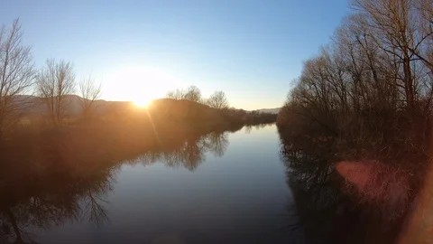 AERIAL Up a calm river at sunset Stock Footage 101077018