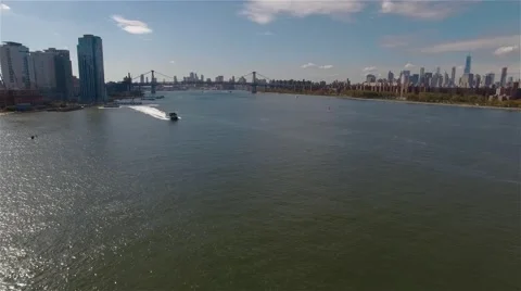 Aerial, camera approaching to Williamsburg Bridge. Floating East River Ferry. Stock Footage 62645201