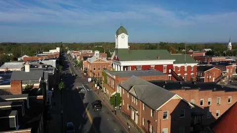 Aerial camera backing away from Charles Town, WV courthouse on the mainstreet. Stock Footage 129619465