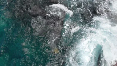 Aerial camera up close captures turtles in the blue waves of the ocean Video stock 135949495