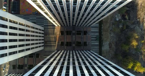 Aerial camera decline between building. Black and white symmetrical texture. Video stock 95732165