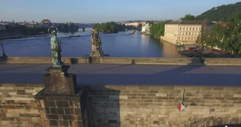 Aerial camera flies backwards fast from the Charles Bridge Stock Footage 65996072