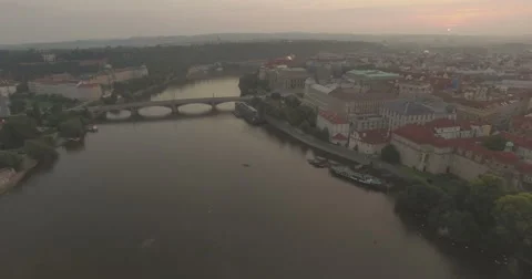 Aerial camera flies backwards fast from the Charles Bridge Stock Footage 66561373