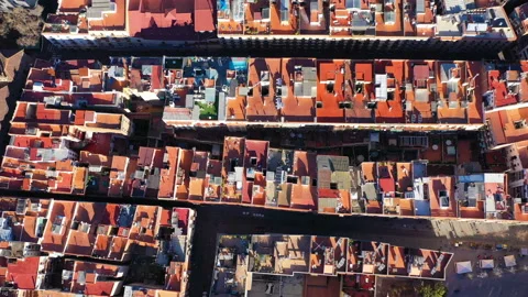 Aerial camera flies over the rooftops of the residential district of Barcelona. 動画素材 106252868