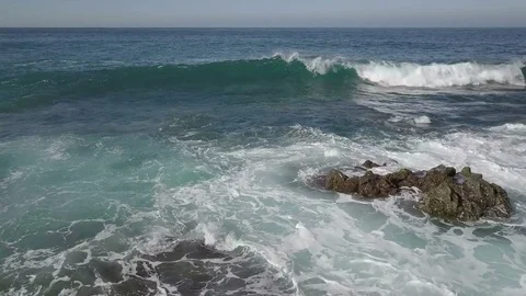 Aerial camera flight above the moving waves with a lot of ocean foam Stock Footage 84721605