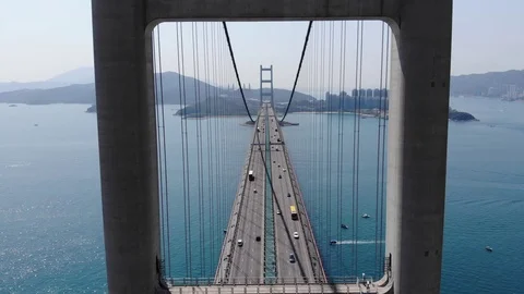 Aerial camera fly through gate of two-legged pylon, large suspension bridge Video stock 91963578