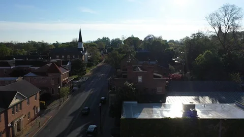 Aerial camera flying low over houses along the mainstream in Charles Town, WV. Stock Footage 129619985