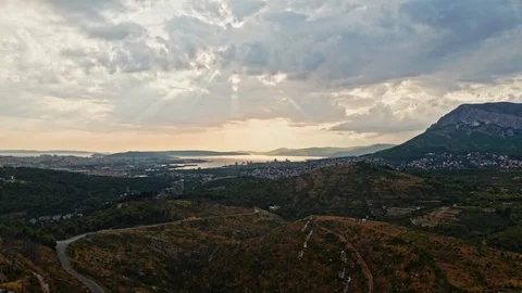 Aerial camera flying over a small hillside with a epic sunset and cloud Stock Footage 122812274
