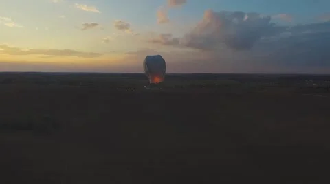 Aerial camera follows sky lantern Stock Footage