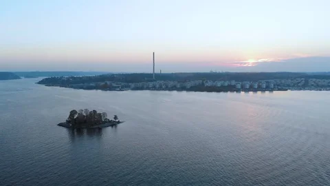Aerial camera goes down on archipelago with green fields forest in background Stock Footage 96391102