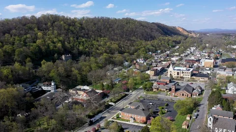 Aerial camera moving to the right showing the quaint town of Berkeley Springs Stock Footage 128842161