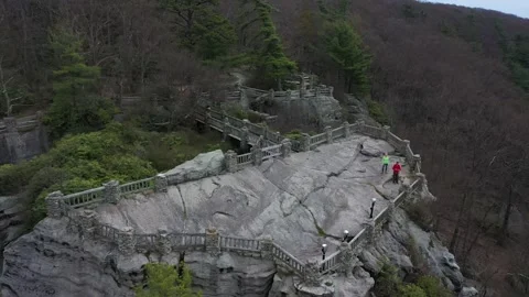Aerial camera orbiting to the left with closeup of the Coopers Rock overlook. Stock Footage 130463530