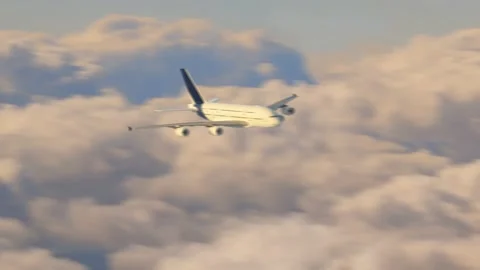 Aerial camera panning a plane flying above the clouds in the sunset. Stock Footage 131751716
