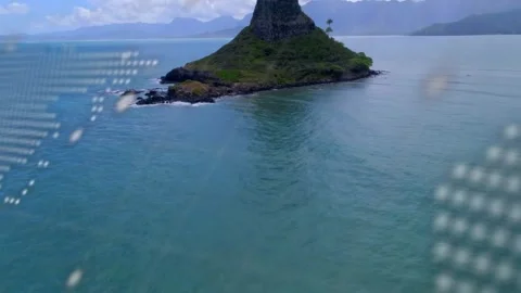 Aerial camera panning starting dotted map code overlay drifting and island Video stock 323454813