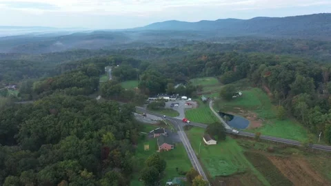 Aerial camera pushing into view of rural elementary school in the West Virginia Stock Footage 163964930