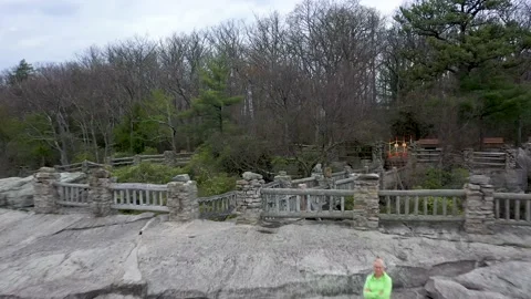 Aerial camera quickly backing away from the Coopers Rock overlook. Stock Footage 130463506