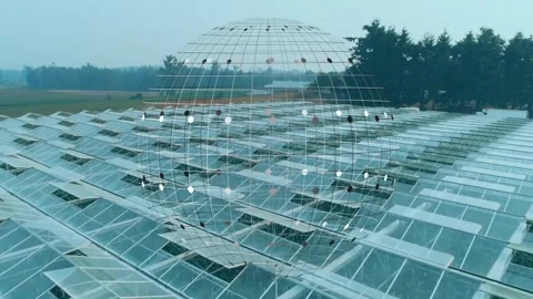 Aerial camera starting glide, wireframe globe rotating and pulsing over Stock Footage 322204442