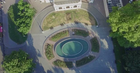 Aerial camera tilts from the pond to the side of the Odessa Opera House Stock Footage 65831771