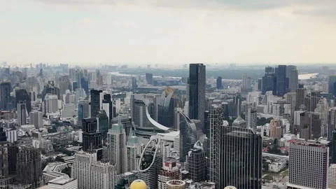 Aerial camera video of dense city skyline under cloudy sky Stock Footage 325560343