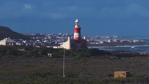 Aerial Cape Agulhas Lighthouse, Atlantic surf, late afternoon view Stock Footage 336287964