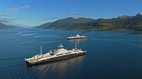 Aerial capture of loaded ro-ro ship cruising through Norway fjord Stock Footage 320730403