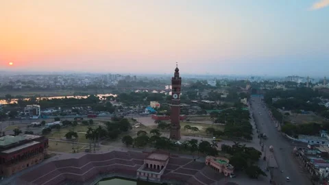 Aerial capture of Lucknow's Clock Tower, with the sunrise casting long shadows Stock Footage 299251686