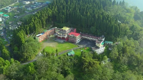 Aerial capture of monasteries glowing under sunlight on Sikkim’s hills. Stock Footage 311370220
