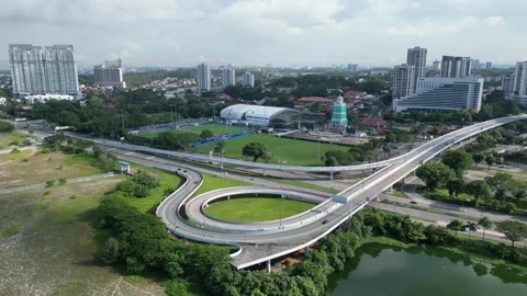 Aerial capture of vehicles crossing a multi-lane bridge within Johor city Stock-Footage 317006128