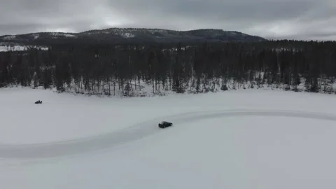 Aerial of car drifting on snow track wit... | Stock Video | Pond5