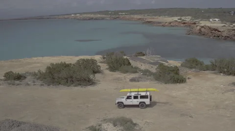 Aerial of car moving on beach 스톡 동영상 68025945