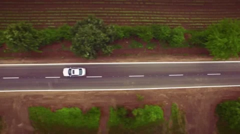 Aerial Of Car Passing By On Small Country Road Rural Countryside Nature Concept Stock Footage