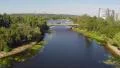 Aerial car traffic on river bridge, beautiful panorama of city HD Footage