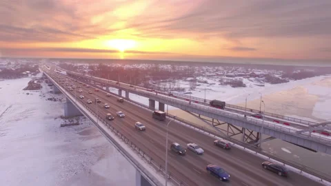 AERIAL: Car traffic on the two parallel bridges during sunset. Video stock 85840090