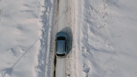 Aerial car view from above. bottom up. snow-covered road Stock Footage 86861981