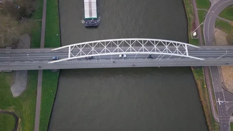 Aerial of Cargo Ship Passing Under Weesper Bridge on the Amsterdam-Rhine Canal Stock Footage 331241153