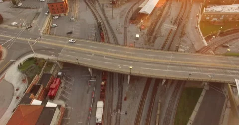 Aerial of cargo train passing under the bridge in slow motion 스톡 동영상 67553817