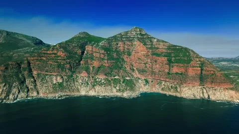 Aerial of Chapman's Peak summit above Noordhoek coastline Stock Footage 339189130