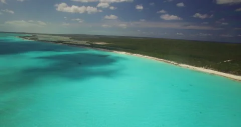 Aerial chasing the clouds over turquoise waters Stock-Footage 66374944