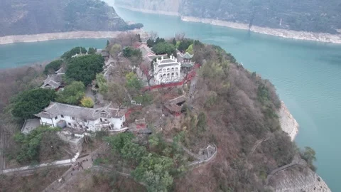 Aerial Chinese Temple Complex on Hilly Island in Deep River Gorge Stock Footage 342305889