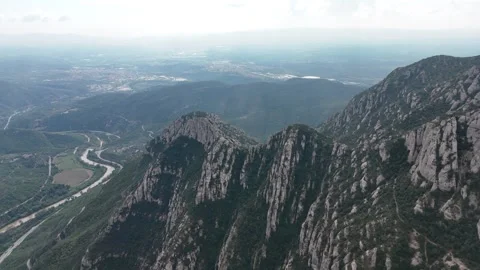 Aerial cinematic flyover of dramatic mountain formations Stock Footage 321345962
