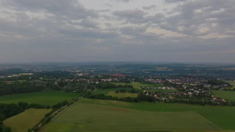 Aerial cinematic forward flight over a small German town after sunset Stock Footage 264185638