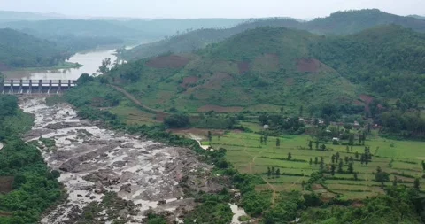 Aerial Cinematic Move From Dam to Waterfall in Tropical forest|Hydropower Aerial Stock Footage 152519853