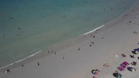 Aerial cinematic shot: Beach with white sand and many people, Thailand Stock Footage 72171053