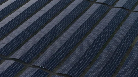 Aerial Cinematic Shot of Solar Power Field at Sunset Environmentally Friendly Stock Footage 310363953