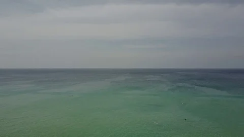 Aerial cinematic view (camera back): infinite tropical turquoise sea and beach Stock Footage 72015764
