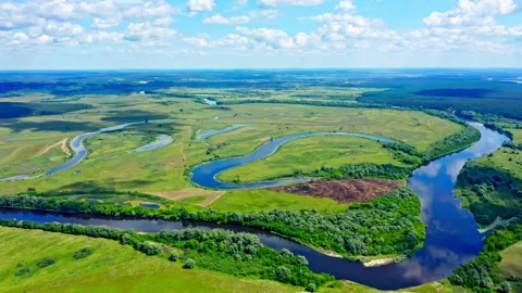 Aerial cinematic view: Drone flies  above a beautiful summer  landscape with  Stock Footage 219933751