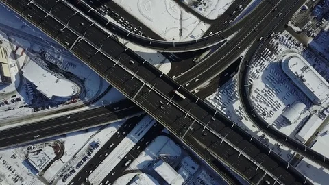 Aerial cinematic view of freeway intersection at spring morning after heavy snow Stock Footage 74508469