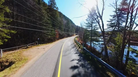 Aerial cinematic view of quebec mountain river in sunlight Stock Footage 320086559