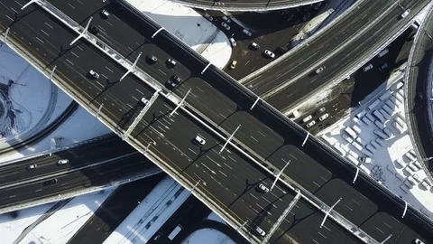 Aerial cinematic view from top:freeway intersection at spring morning after snow Stock Footage 74508459