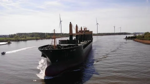Aerial Circle Dolly Around Forward Bow Of Aal Paris Cargo Ship Travelling Stock Footage 195333868